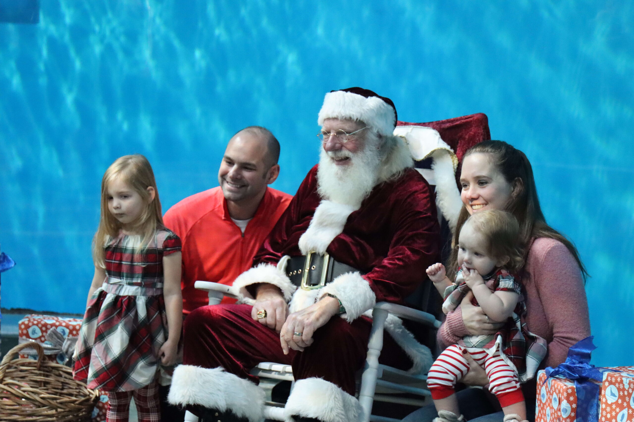 family getting picture taken with Santa