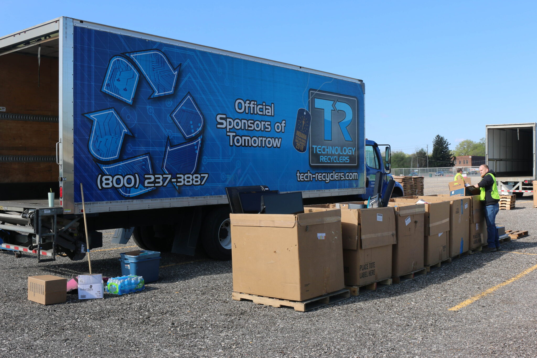 recycling truck in parking lot receiving donations at the Indianapolis Zoo