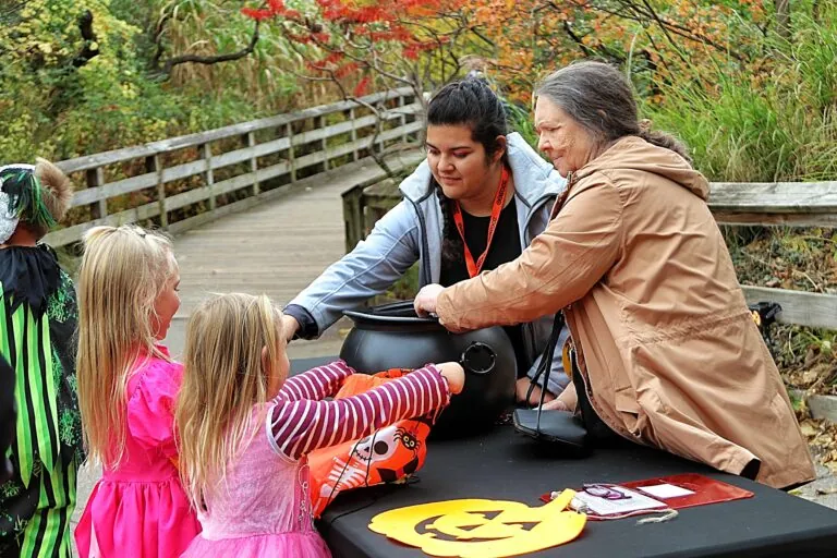 zooboo trick or treat volunteers handing out candy