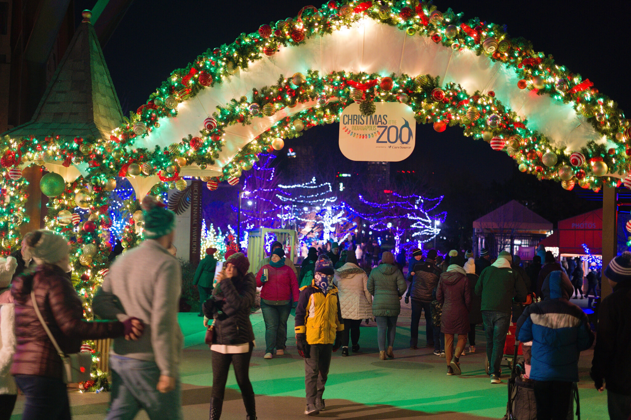 Arch entry with Christmas lights and decor at the Indianapolis Zoo