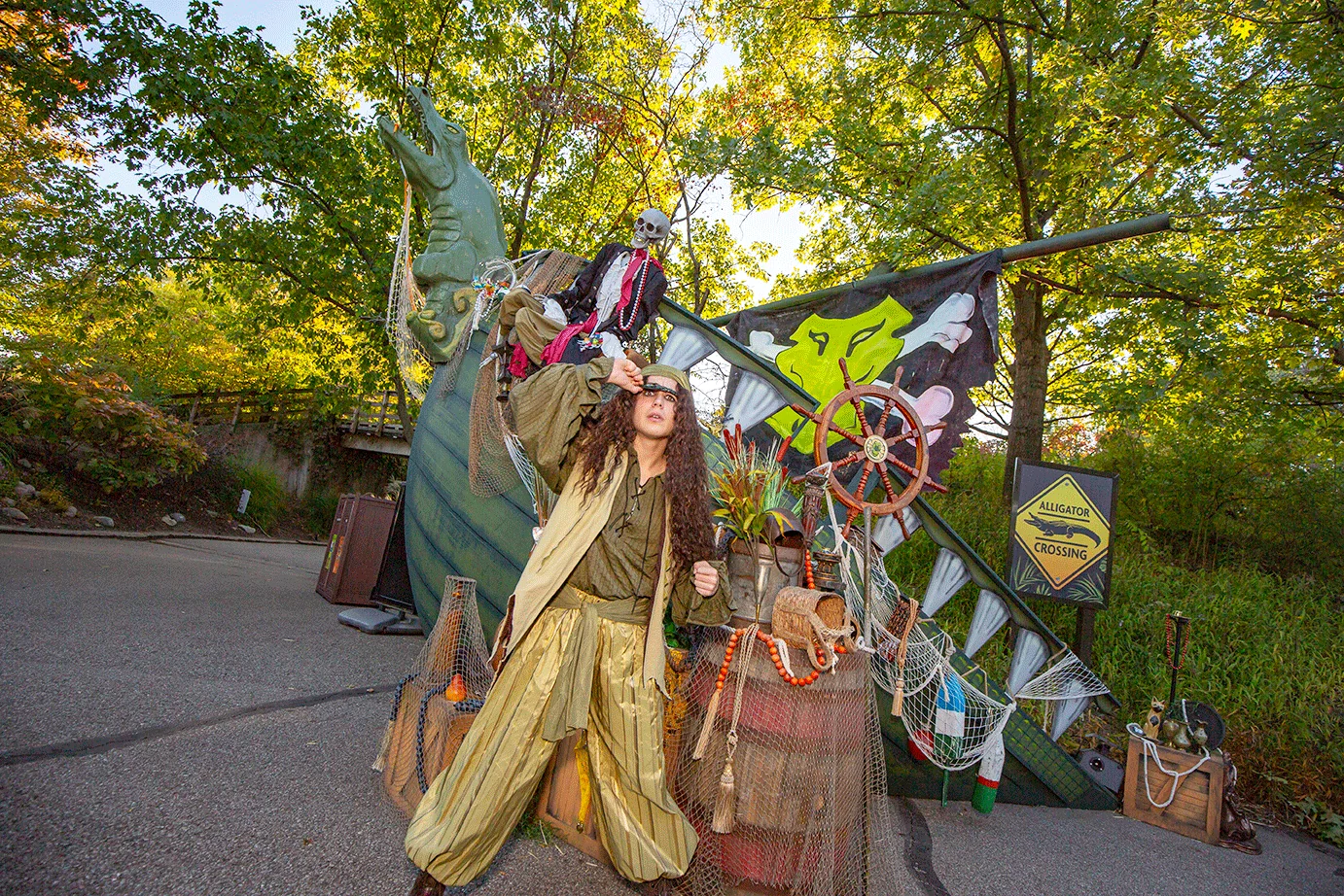 man dressed as pirate with props