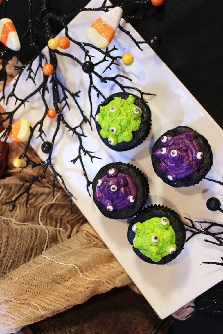 cupcakes with purple and green frosting