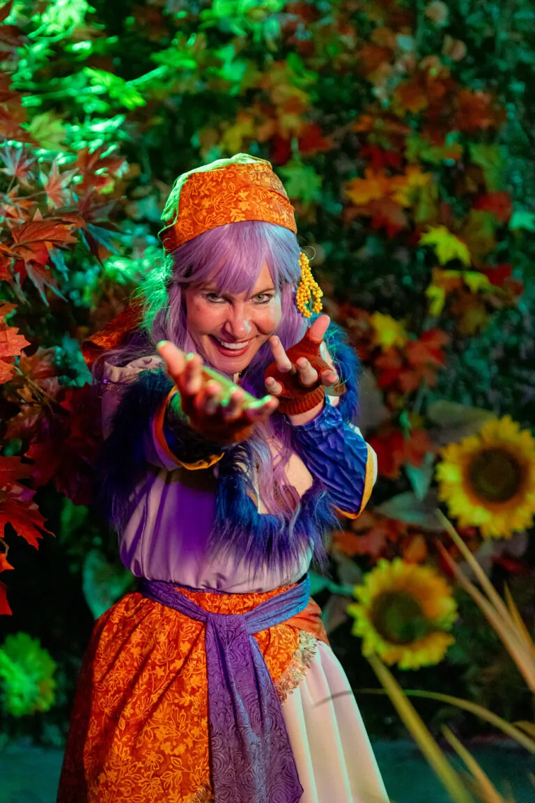 woman dressed as a fortune teller in a garden