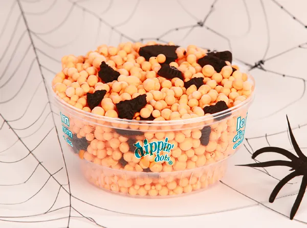 dippin dots ice cream with orange colored dots and cookie pieces